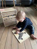 Puslespilsreol med 12 knop-puslespil