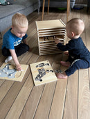 Puslespilsreol med 12 knop-puslespil