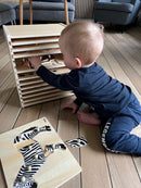 Puslespilsreol med 12 knop-puslespil