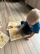 Puslespilsreol med 12 knop-puslespil