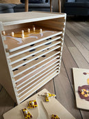 Puslespilsreol med 12 knop-puslespil