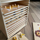 Puslespilsreol med 12 knop-puslespil