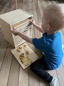 Puslespilsreol med 12 knop-puslespil