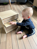 Puslespilsreol med 12 knop-puslespil