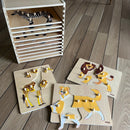 Puslespilsreol med 12 knop-puslespil