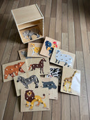 Puslespilsreol med 12 knop-puslespil