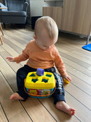 Puttekasse i plast med hank fra Fisher-Price.