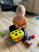 Puttekasse i plast med hank fra Fisher-Price.