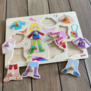 Knoppuslespil fra Goki med Dress-Up pige i træ - 10 brikker.